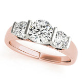 Rose gold Three-Stone Round Brilliant Diamond Ring with Channel Setting and White Gold Band