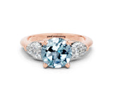 Rose gold Three-Stone Round Cut Aquamarine Ring with Pear Side Stones and Four-Prong Setting