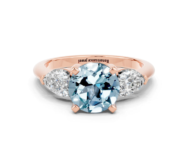 Rose gold Three-Stone Round Cut Aquamarine Ring with Pear Side Stones and Four-Prong Setting