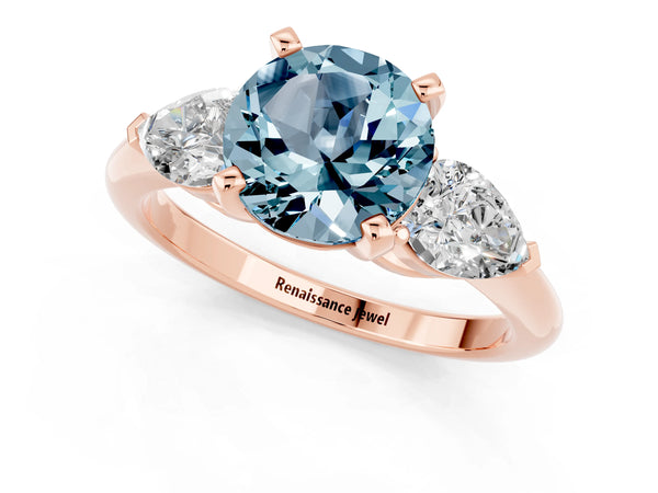 Rose gold Three-Stone Round Cut Aquamarine Ring with Pear Side Stones and Four-Prong Setting