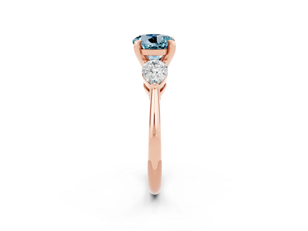 Rose gold Three-Stone Round Cut Aquamarine Ring with Pear Side Stones and Four-Prong Setting