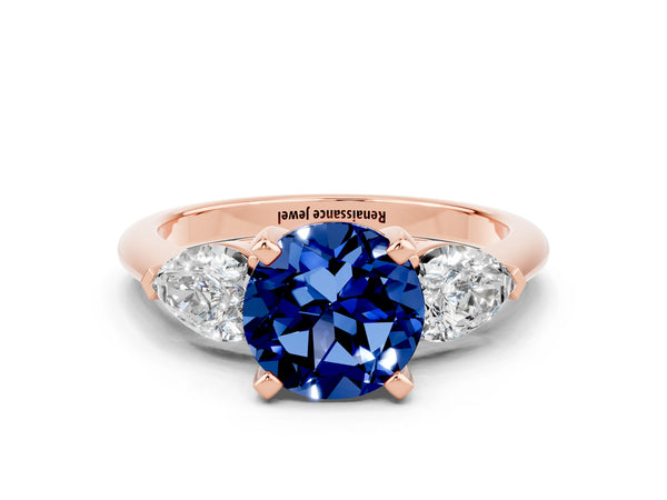 Rose gold Three-Stone Round Cut Blue Sapphire Ring with Pear Side Stones and Four-Prong Setting