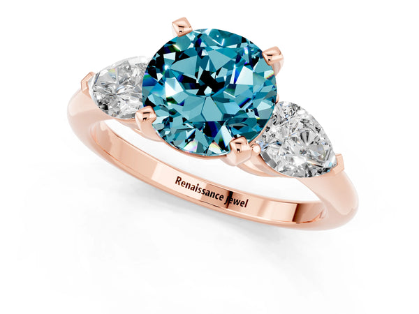 Rose gold Three-Stone Round Cut Blue Topaz Ring with Pear Side Stones and Four-Prong Setting