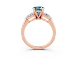 Rose gold Three-Stone Round Cut Blue Topaz Ring with Pear Side Stones and Four-Prong Setting_3