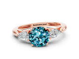 Rose gold Three-Stone Round Cut Blue Topaz Ring with Pear  Side Stones in Four-Prong Setting_12