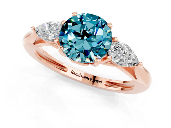 Rose gold Three-Stone Round Cut Blue Topaz Ring with Pear  Side Stones in Four-Prong Setting