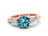 Rose gold Three-Stone Round Cut Blue Topaz Ring with Pear  Side Stones in Four-Prong Setting_36