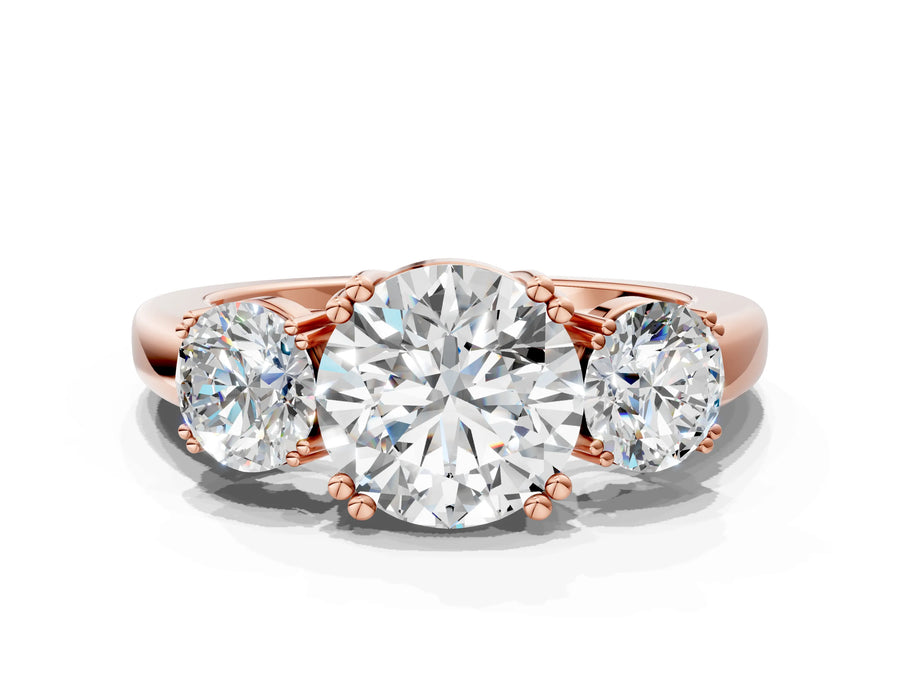 Rose gold Three-Stone Round Cut Cut Diamond Ring with Channel Set Band and Four-Prong Setting