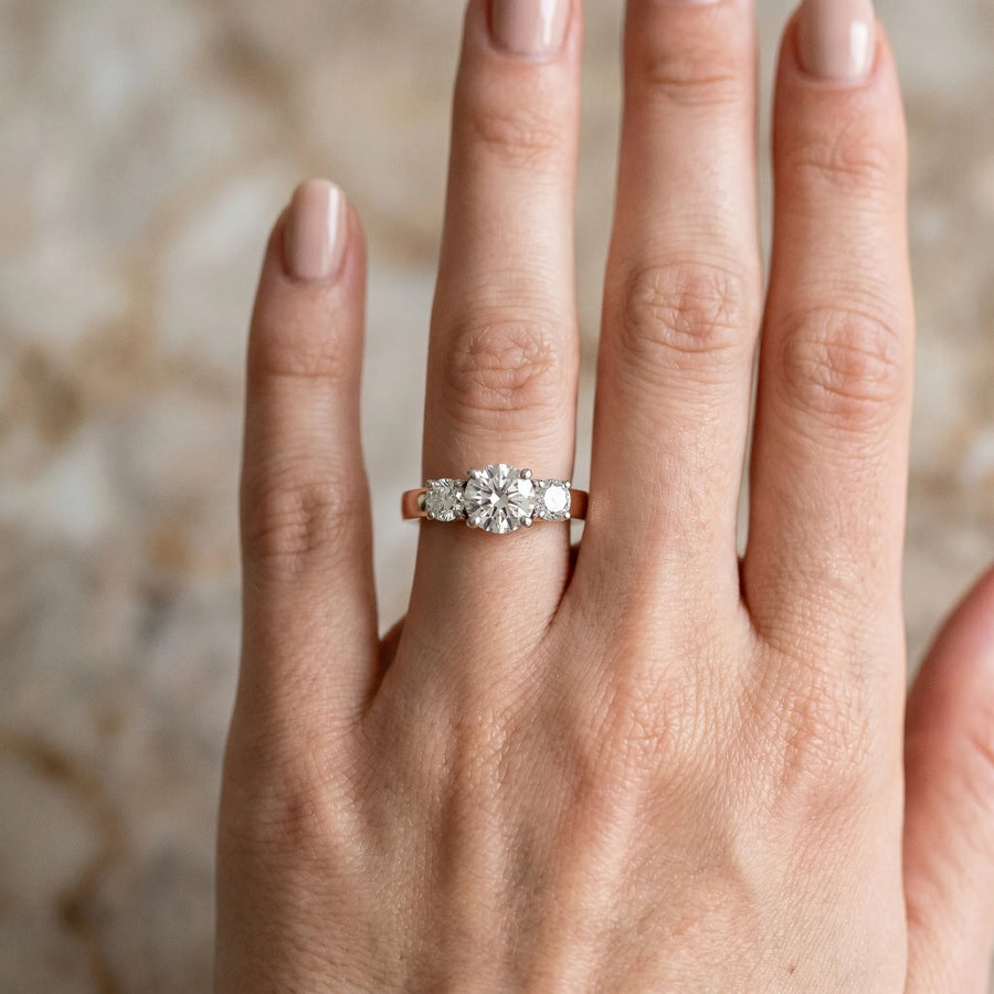 Rose gold Three-Stone Round Cut Diamond Engagement Ring with Flat Band and Four-Prong Setting