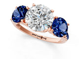 Rose gold Three-Stone Round Cut Diamond Ring with Round with Blue Sapphire side stone Pavé Band and Prong Setting_1