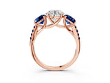 Rose gold Three-Stone Round Cut Diamond Ring with Round with Blue Sapphire side stone Pavé Band and Prong Setting_3