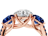 Rose gold Three-Stone Round Cut Diamond Ring with Round with Blue Sapphire side stone Pavé Band and Prong Setting_4