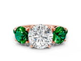 Rose gold Three-Stone Round Cut Diamond Ring with Round with Emerald side stone Pavé Band and Prong Setting