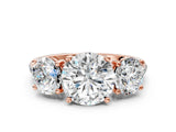 Rose gold Three-Stone Round Cut Diamond Ring with Round with Moissanite side stone Pavé Band and Prong Setting