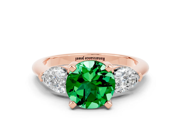 Rose gold Three-Stone Round Cut Emerald Ring with Pear Side Stones and Four-Prong Setting
