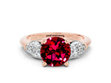 Rose gold Three-Stone Round Cut Garnet Ring with Pear Side Stones and Four-Prong Setting