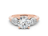 Rose gold Three-Stone Round Cut Moissanite Ring with Pear Side Stones and Four-Prong Setting