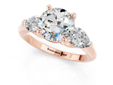 Rose gold Three-Stone Round Cut Moissanite Ring with Pear Side Stones and Four-Prong Setting_1