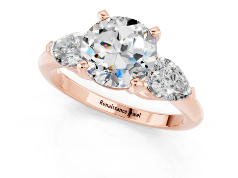Rose gold Three-Stone Round Cut Moissanite Ring with Pear Side Stones and Four-Prong Setting_1