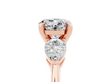 Rose gold Three-Stone Round Cut Moissanite Ring with Pear Side Stones and Four-Prong Setting_5
