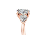Rose gold Three-Stone Round Cut Moissanite Ring with Pear  Side Stones in Four-Prong Setting_17