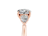 Rose gold Three-Stone Round Cut Moissanite Ring with Pear  Side Stones in Four-Prong Setting_41