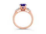 Rose gold Three-Stone Round Cut Tanzanite Ring with Pear Side Stones and Four-Prong Setting_3