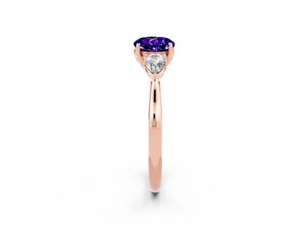 Rose gold Three-Stone Round Cut Tanzanite Ring with Pear  Side Stones in Four-Prong Setting