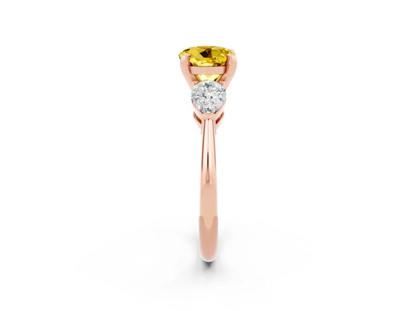 Rose gold Three-Stone Round Cut Yellow Sapphire Ring with Pear Side Stones and Four-Prong Setting