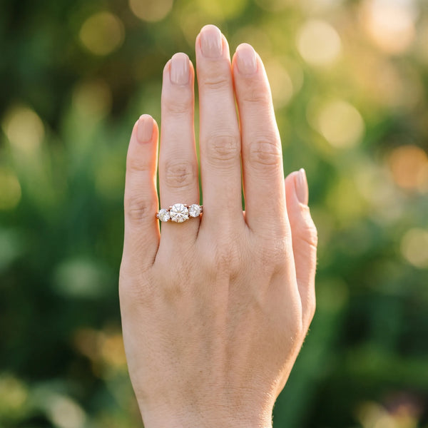 Rose gold Three-Stone Round Diamond Engagement Ring with Prong Setting on a Classic Band
