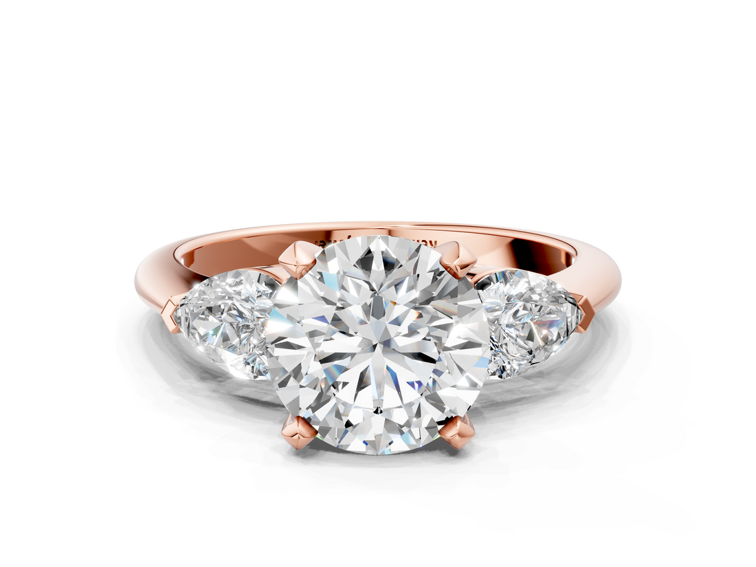 Rose gold Three-Stone Round Diamond Ring with Pear Side Stones in Four-Prong Setting_65