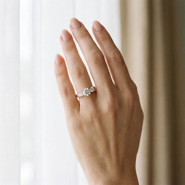 Rose gold Three-Stone Round Diamond Solitaire Ring with Channel Band and Prong Setting