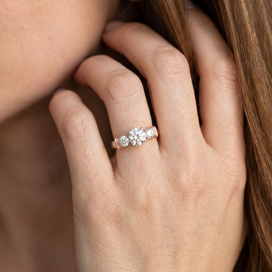 Rose gold Three-Stone Round Diamond Solitaire Ring with Channel Band and Prong Setting
