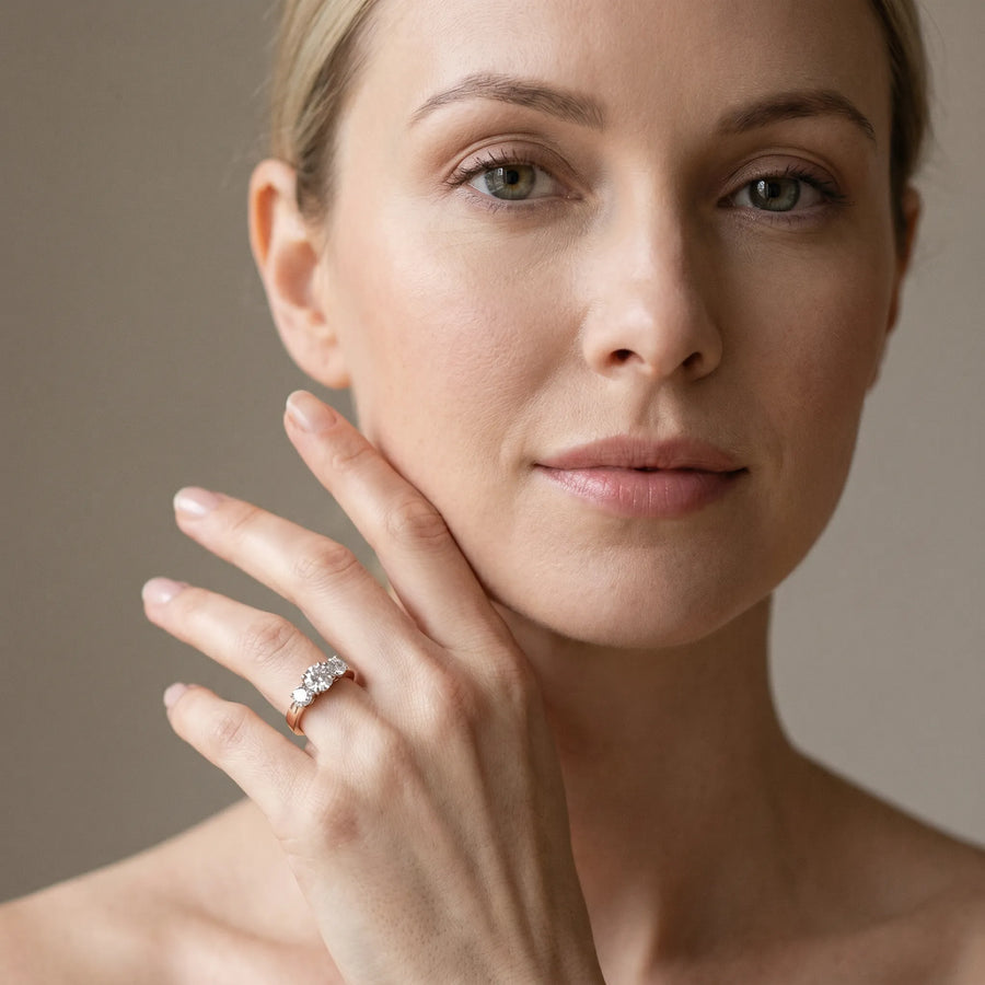 Rose gold Three-Stone Round Diamond Solitaire Ring with Channel Set Band and Four-Prong Setting