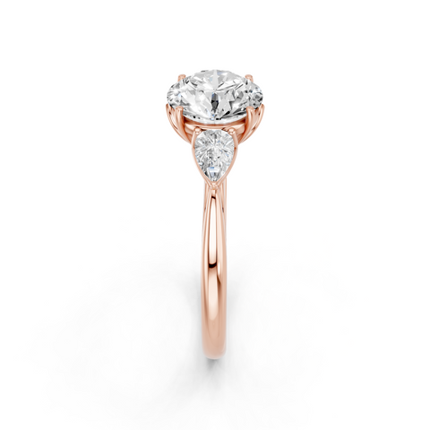 Rose gold Three-Stone Round Diamond Solitaire Ring with Pear Side Stones and Four-Prong Setting_4