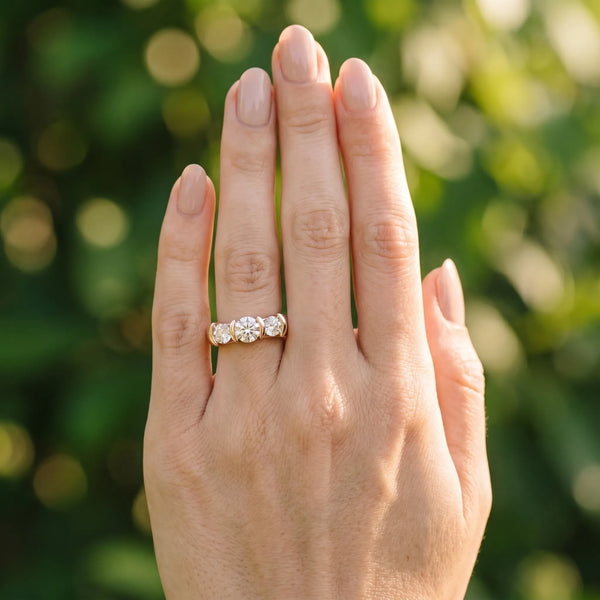 Rose gold Three-Stone Round Diamond Trellis Engagement Ring with Channel-Set Band