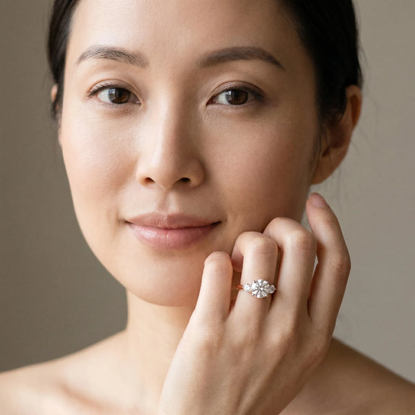 Rose gold Three-Stone Round Solitaire Ring with Tapered Band and Four-Prong Setting