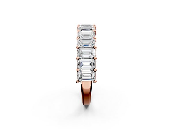 Rose gold emerald cut diamond half eternity band with shared prong setting