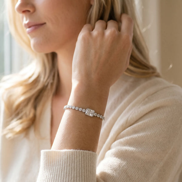 Silver Bezel-Set Round Diamond Tennis Bracelet with Radiant Center Diamond