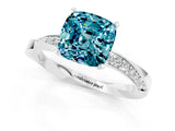 Silver Cushion Cut Blue Topaz Engagement Ring with Side Stone Accents and Four-Prong Setting_13