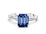 Silver Emerald Cut Blue Sapphire Engagement Ring with Side Stone Accents and Four-Prong Setting_24