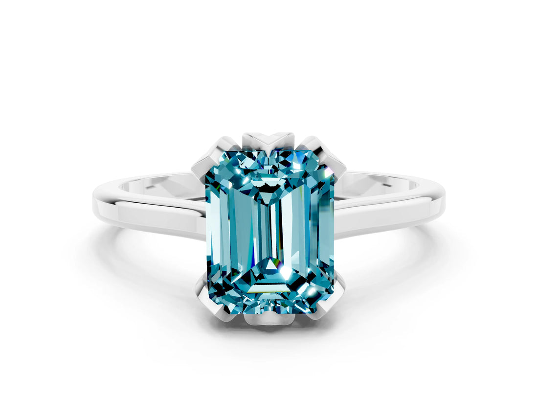 Silver Emerald Cut Blue Topaz Solitaire Ring with Flower Prong Setting and Classic Band
