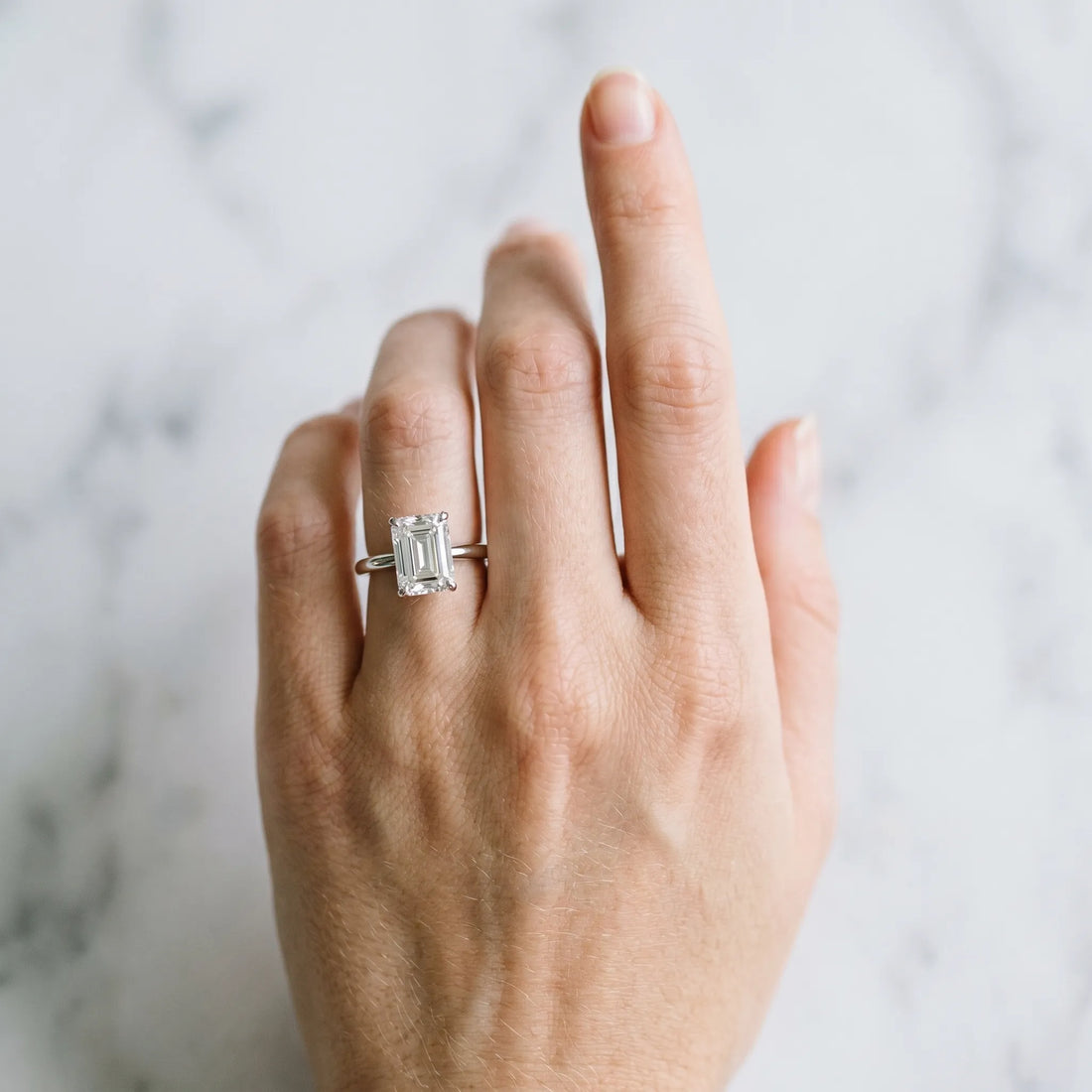 Silver Emerald Cut Diamond Solitaire Engagement Ring with Classic Band and Four-Prong Setting_162