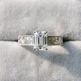 Silver Emerald Cut Diamond Solitaire Ring with Engraved Band and Four-Prong Setting_99