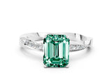 Silver Emerald Cut Green Sapphire Engagement Ring with Side Stone Accents and Four-Prong Setting_24