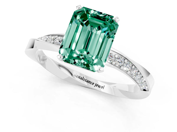 Silver Emerald Cut Green Sapphire Engagement Ring with Side Stone Accents and Four-Prong Setting