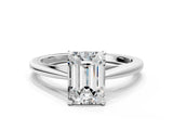 Silver Emerald Solitaire Engagement Ring with Four-Prong Setting and Classic Band