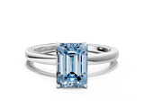 Silver Fancy Blue Emerald Cut Diamond Solitaire Ring with Thin Band and Prong Setting