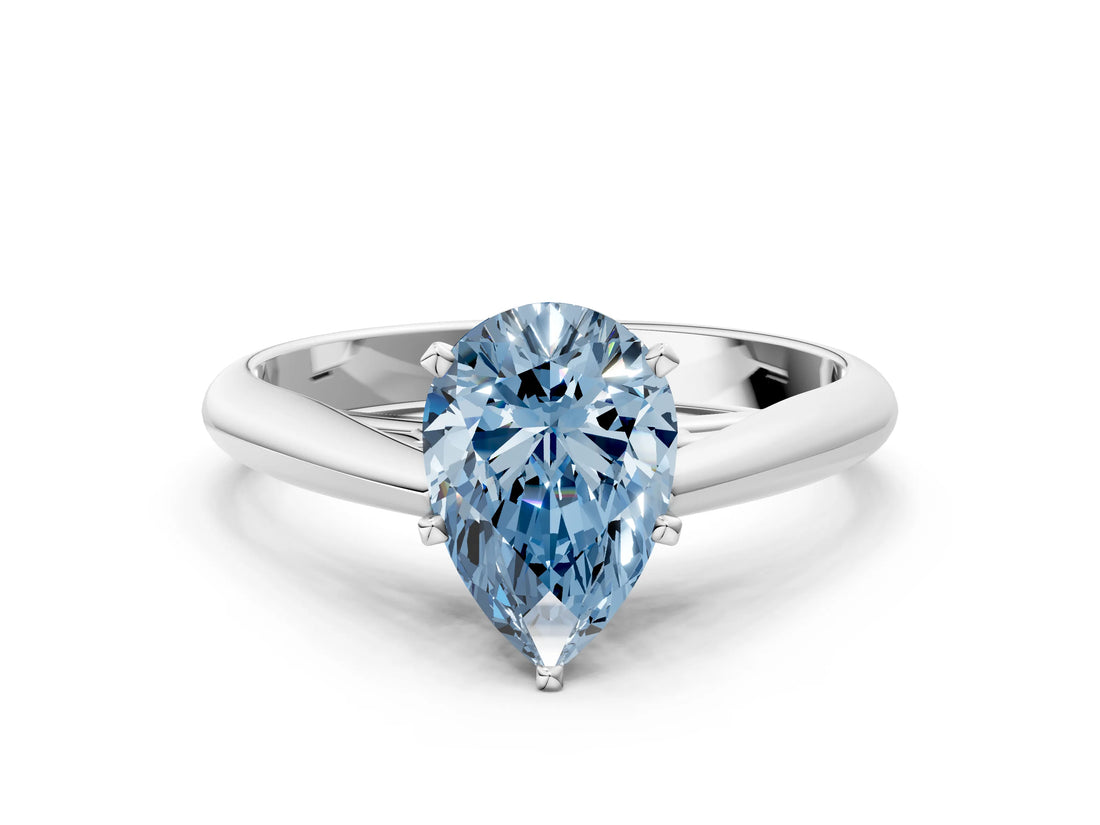 Silver Fancy Blue Pear Cut Diamond Solitaire Engagement Ring with Cathedral Setting and Four-Prong Mount