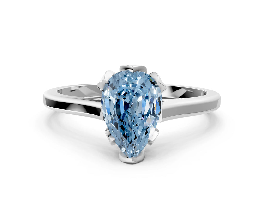 Silver Fancy Blue Pear Cut Diamond Solitaire Ring with Flower Prong Setting and Classic Band